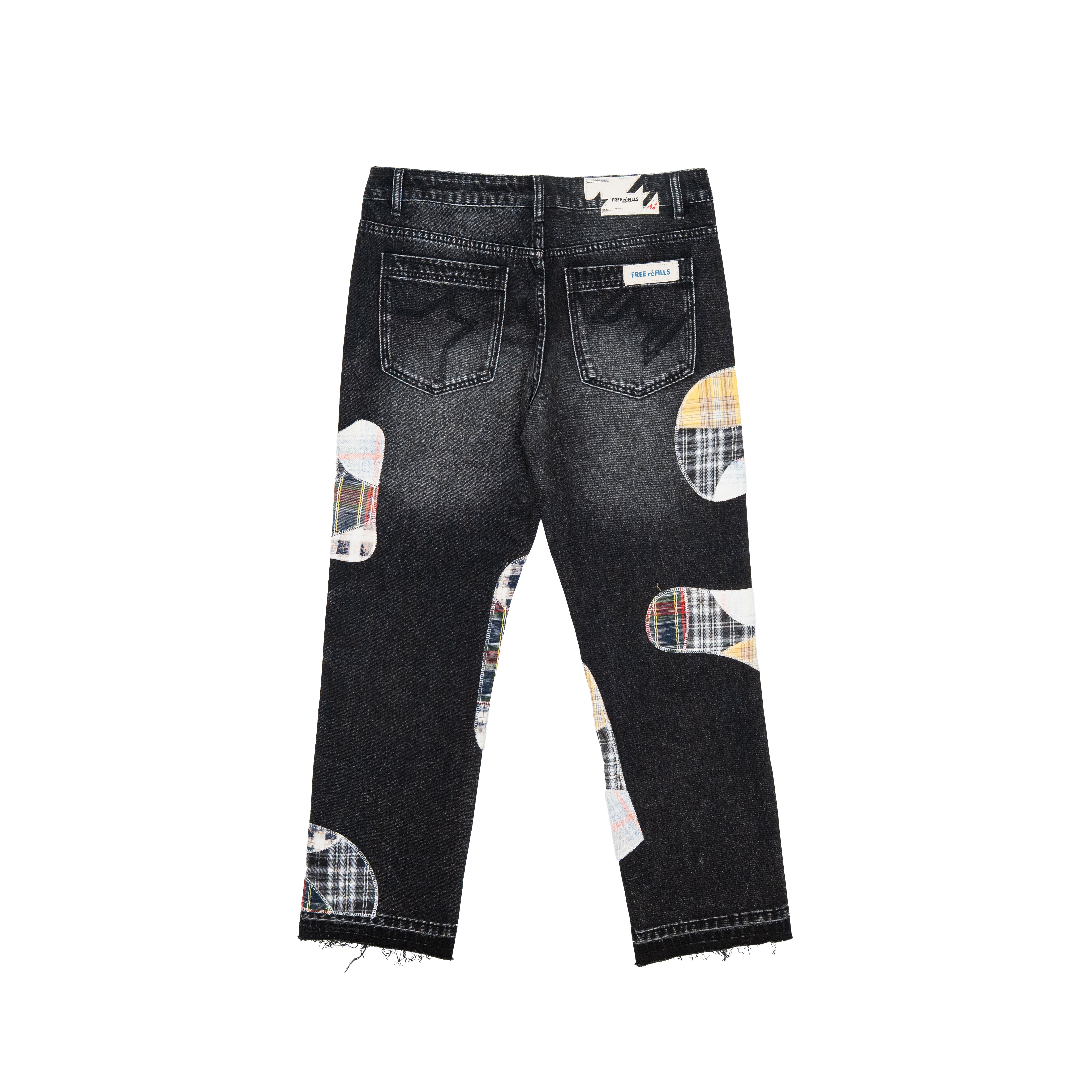 Back view of a pair of dark wash denim jeans with asymmetrical plaid patchwork knee and hem patches, shown on a plain white background.