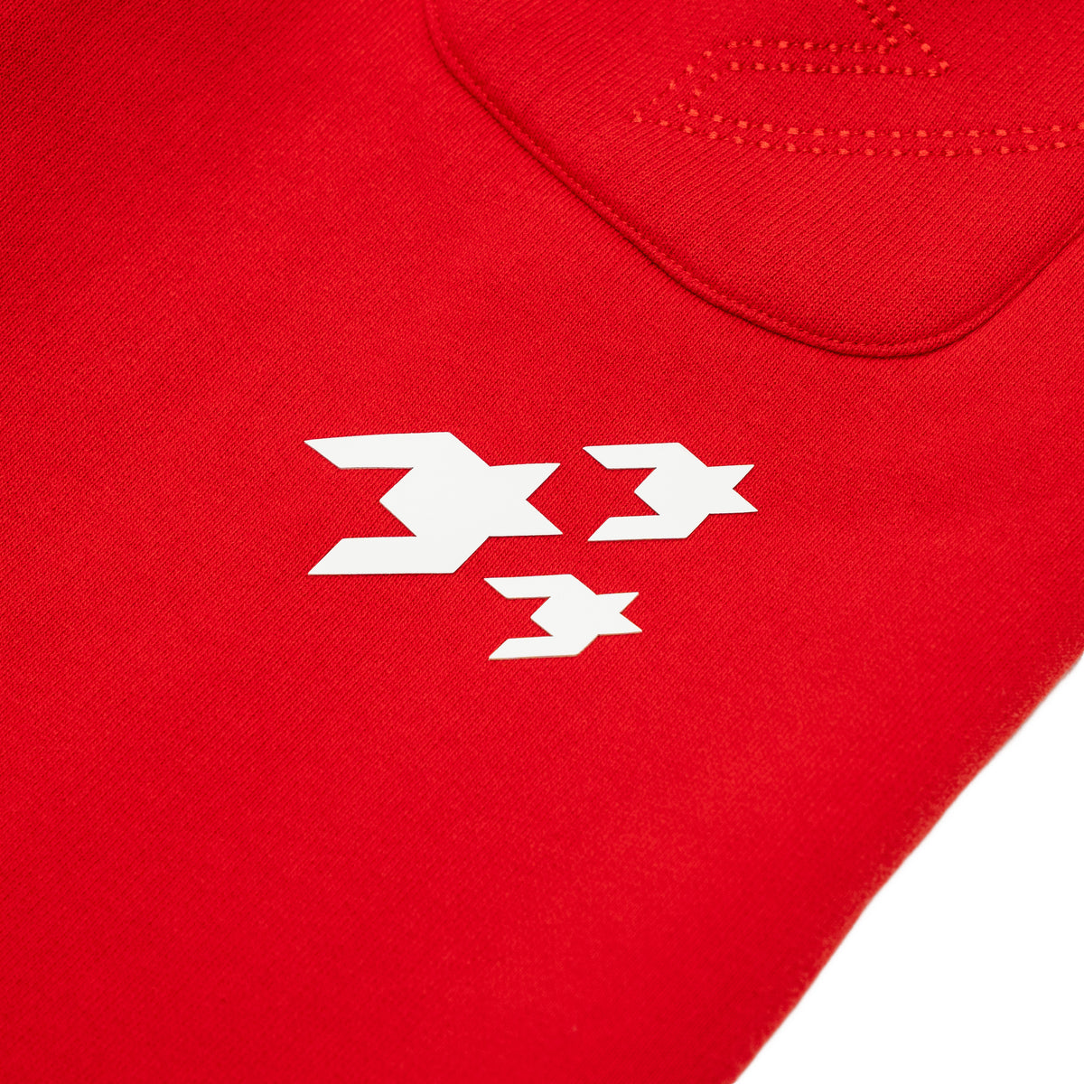 Sunday Service Flare Bottoms – Red – Close-up of white graphics below back pocket