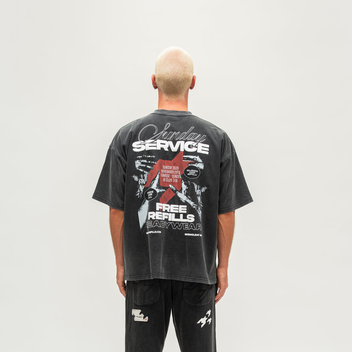 Sunday Service Tee – Black – Back view on model showing large Sunday Service graphic