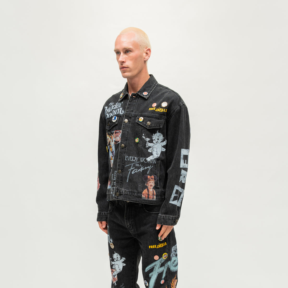 The Powder Room Jacket – Black – Angled view on model showing chest pockets and sleeve graphics