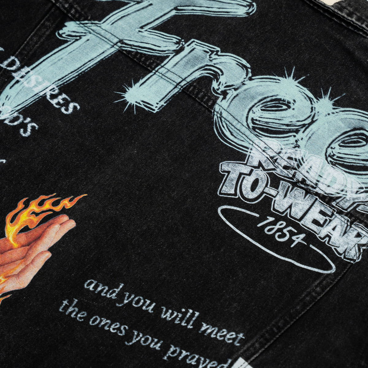 The Powder Room Jacket – Black – Close-up of pale blue Free lettering and flaming hand back graphic