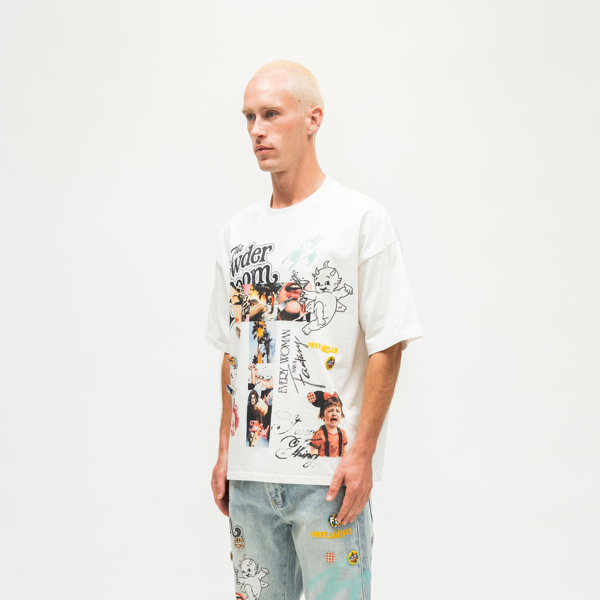 The Powder Room Tee – Cream – Model wearing the tee, three-quarter view showing dropped shoulders and front graphics