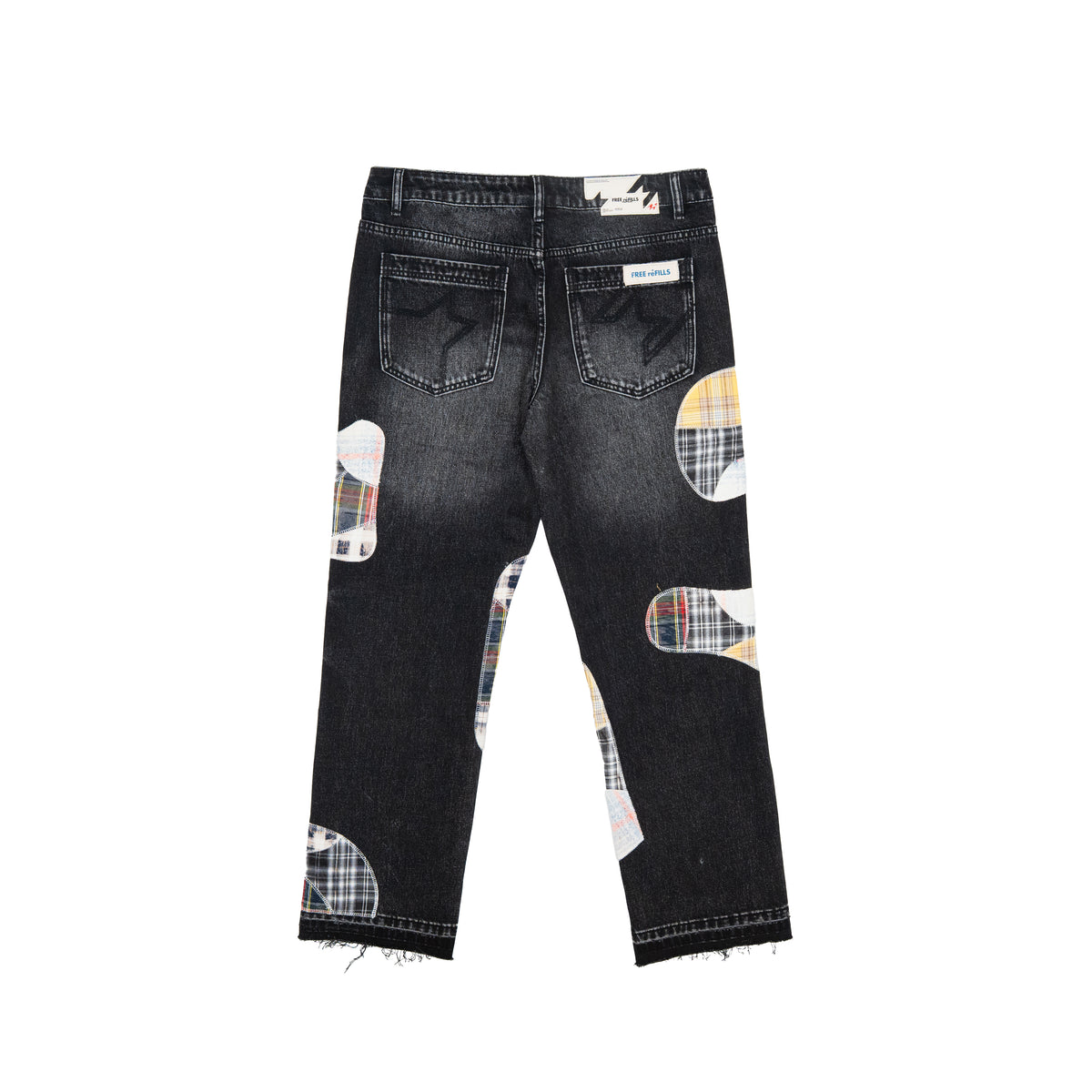 Back view of a pair of dark wash denim jeans with asymmetrical plaid patchwork knee and hem patches, shown on a plain white background.
