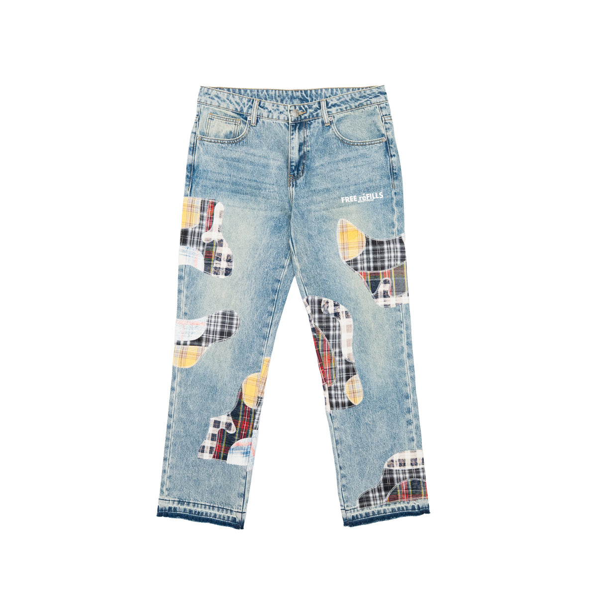 Light blue denim jeans with large abstract patchwork appliques in plaid and solid colors on the front legs, featuring a button fly and white 'FREE REFILLS' text on the upper right thigh, shown flat on a white background.