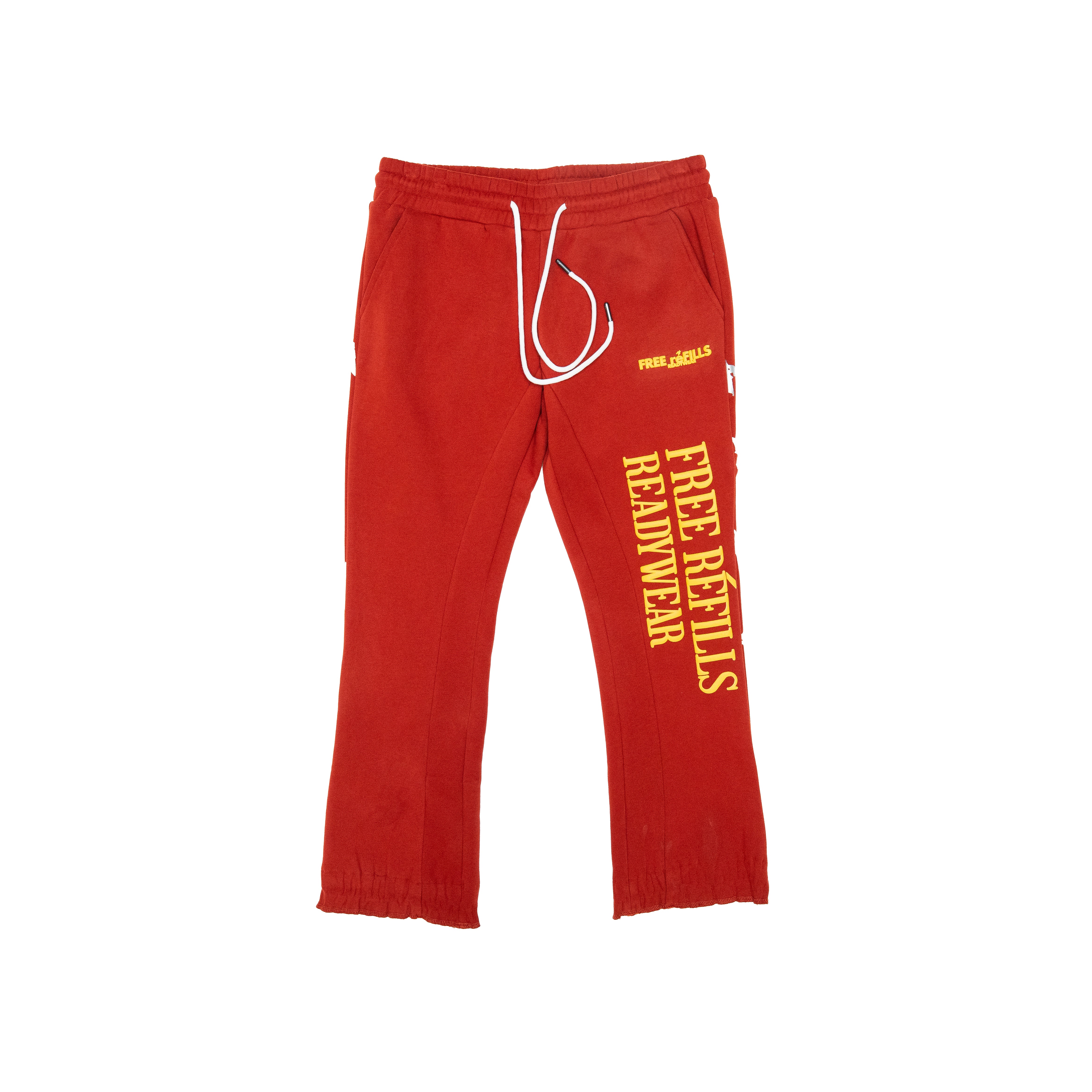 Red sweatpants with yellow vertical text reading 'FREE REFILLS READYWEAR' on the left leg, a white drawstring, and a small white logo on the right hip, shown on a plain white background.