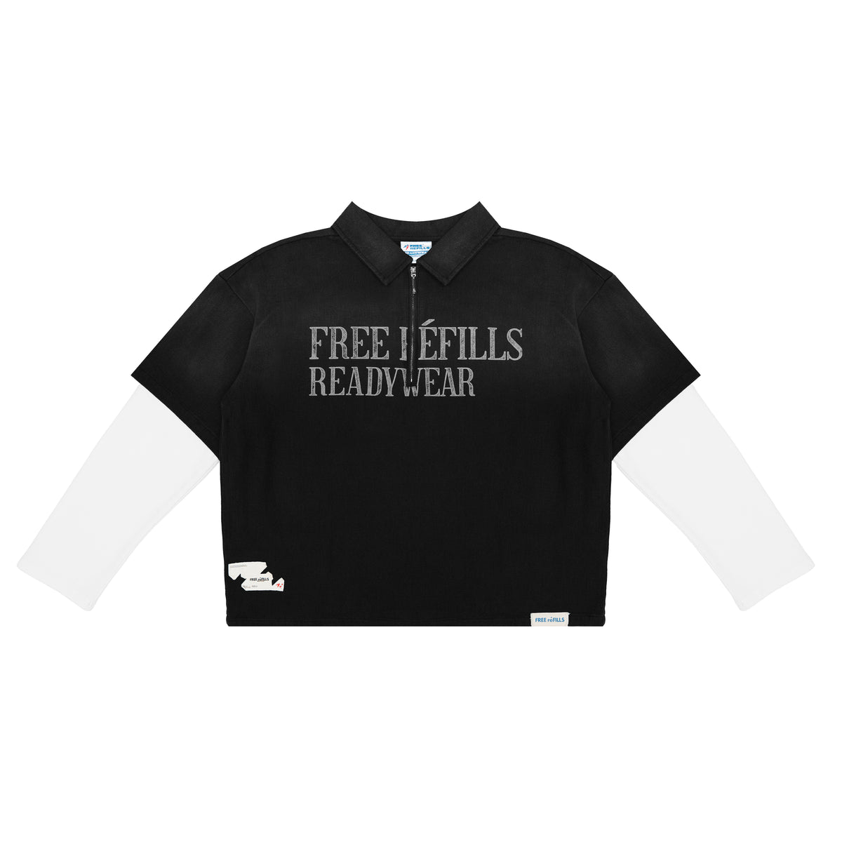 A black cropped quarter-zip polo shirt with long white sleeves, featuring the text 'FREE REFILLS READYWEAR' printed in gray across the chest.
