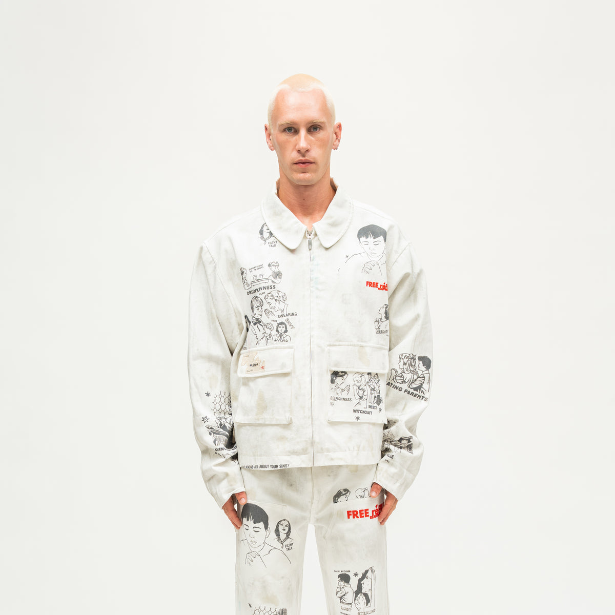 Miracle Jacket – Off White – Front view on model showing zip closure, illustrated graphics, and flap pockets