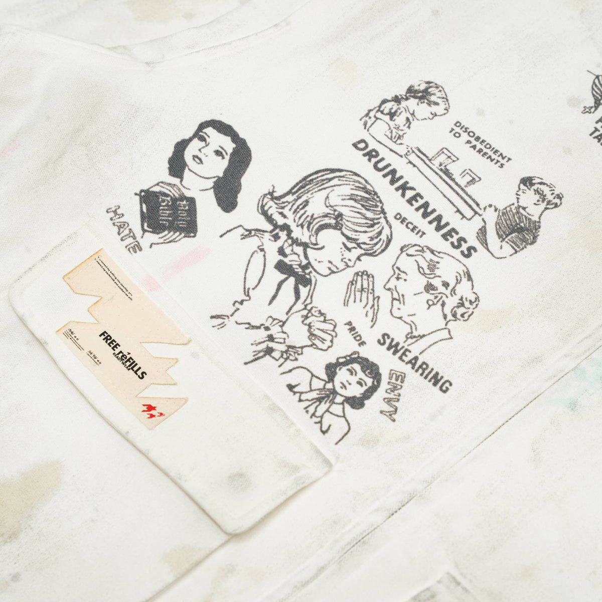 Miracle Jacket – Off White – Close-up of black illustrated graphics and branded flap pocket