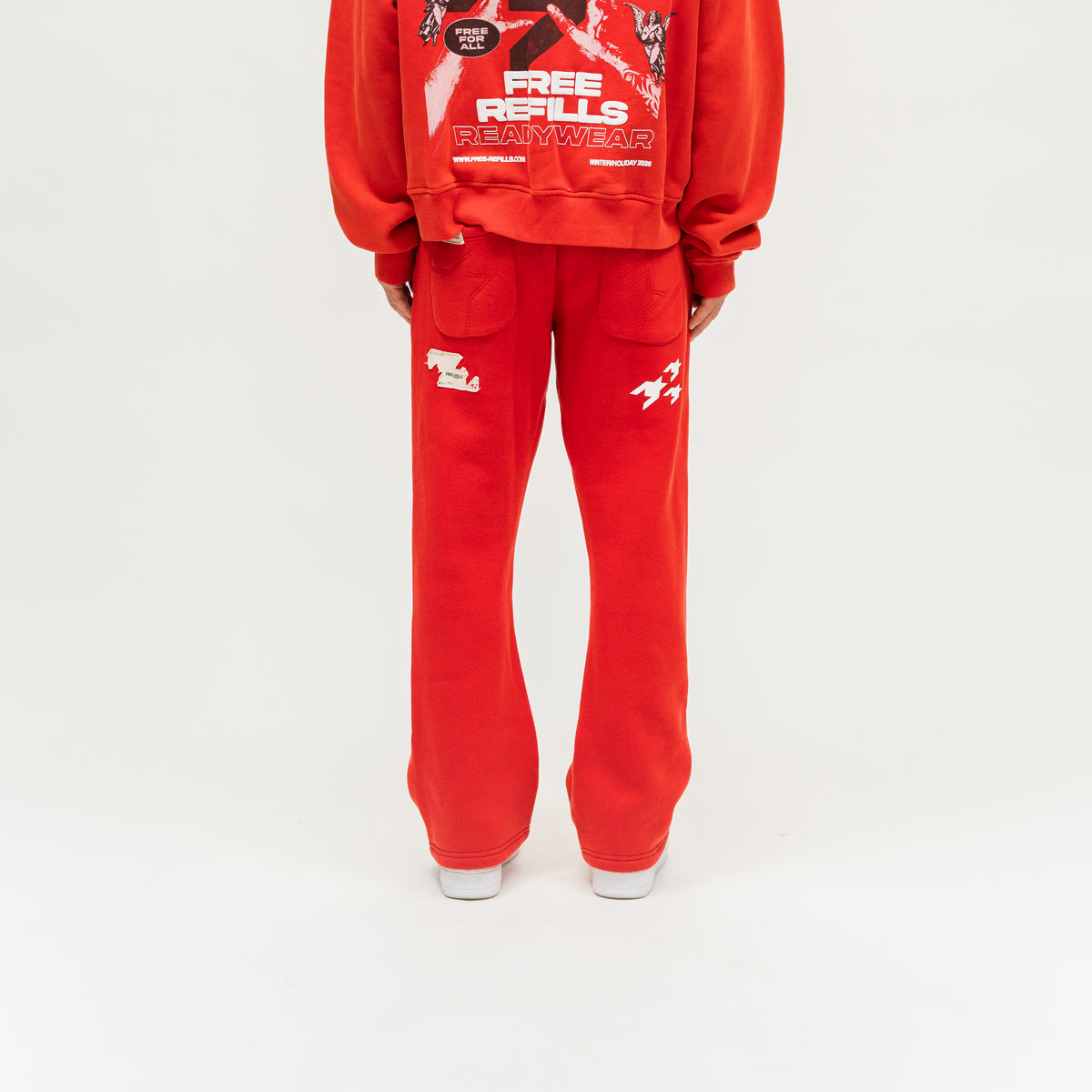 Sunday Service Flare Bottoms – Red – Back view on model showing patch pockets and white graphics