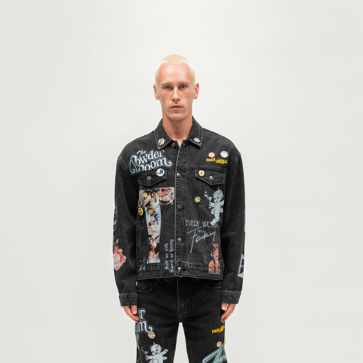 The Powder Room Jacket – Black – Front view on model showing button closure, graphic prints and decorative pins