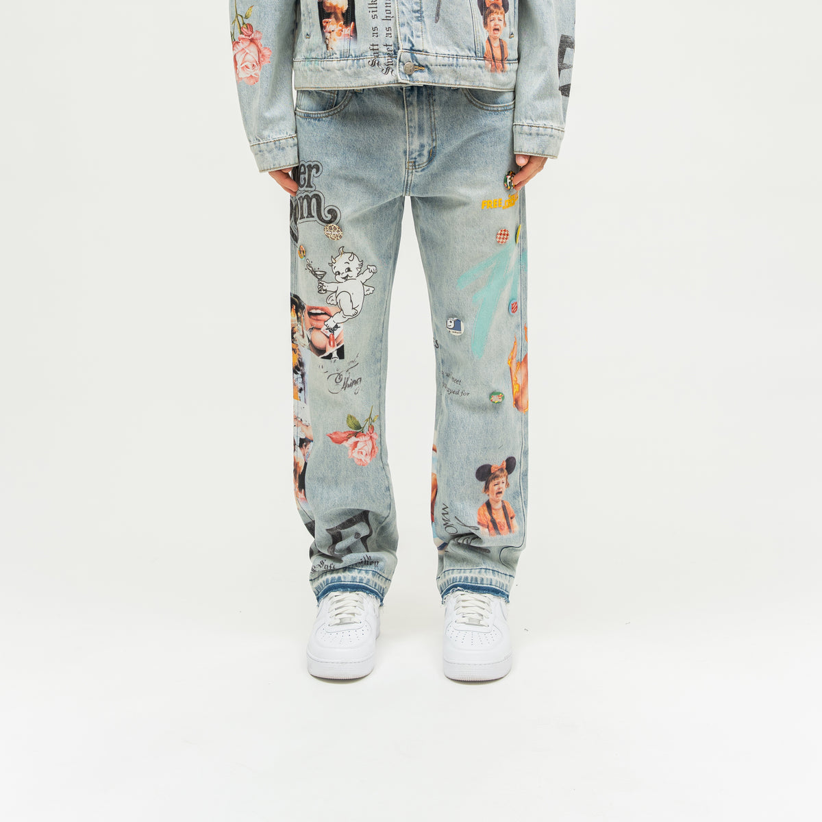 The Powder Room Jeans – Blue – Front view on model showing collage prints and decorative pins